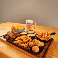 Rodízio Outback com aperitivos clássicos e chopp Brahma 340ml.